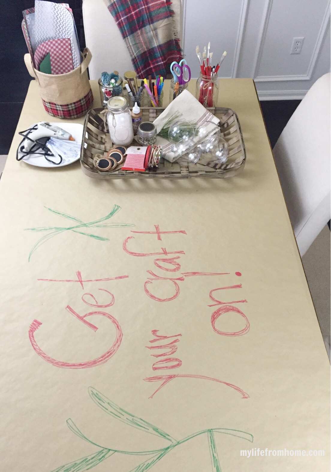 Ribbon, paper and embellishments arranged for making Christmas ornaments