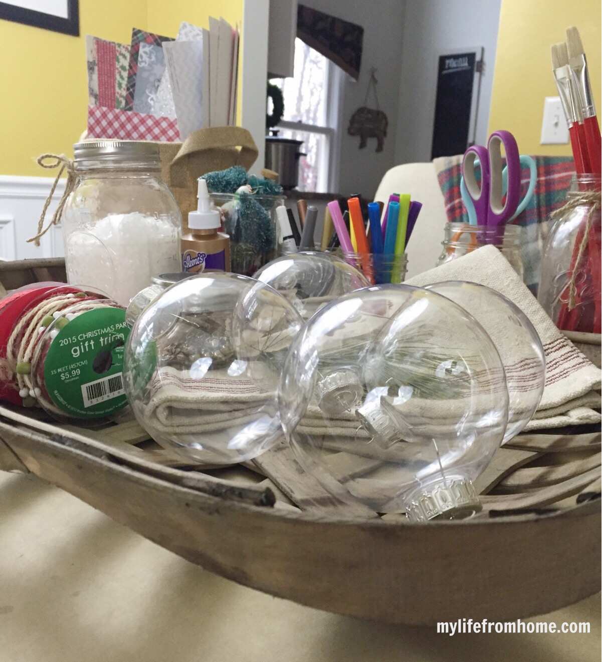 Clear baubles and festive materials ready for a Christmas craft night