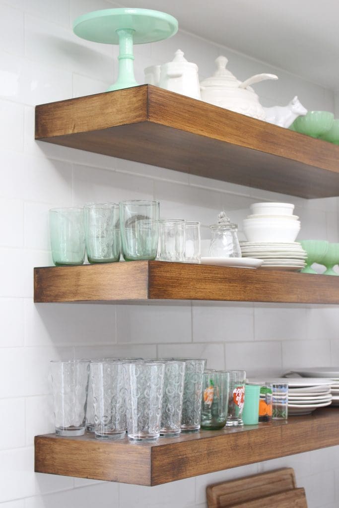 white- cottage- kitchen- renovation- vintage- decor- decorating a white kitchen- farmhouse style- antique brass pulls- hardware- subway tile- floating kitchen shelves
