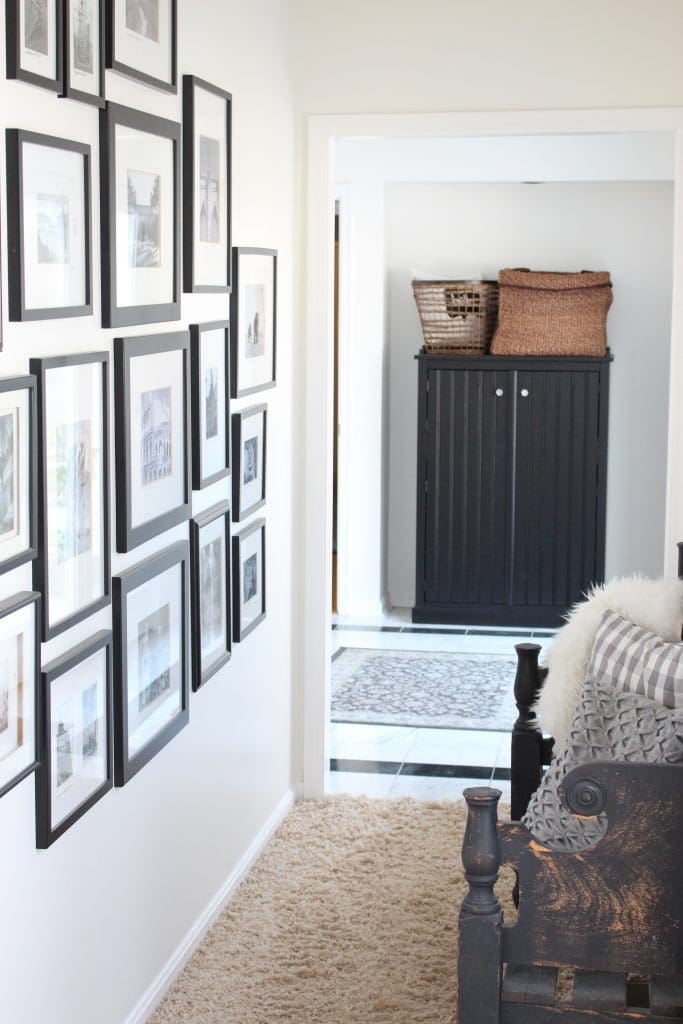 travel gallery- wall gallery- travel photos- how to display- hallway decorating- long hallway- decor- wall decor- black and white photographs- master suite- hallway decor