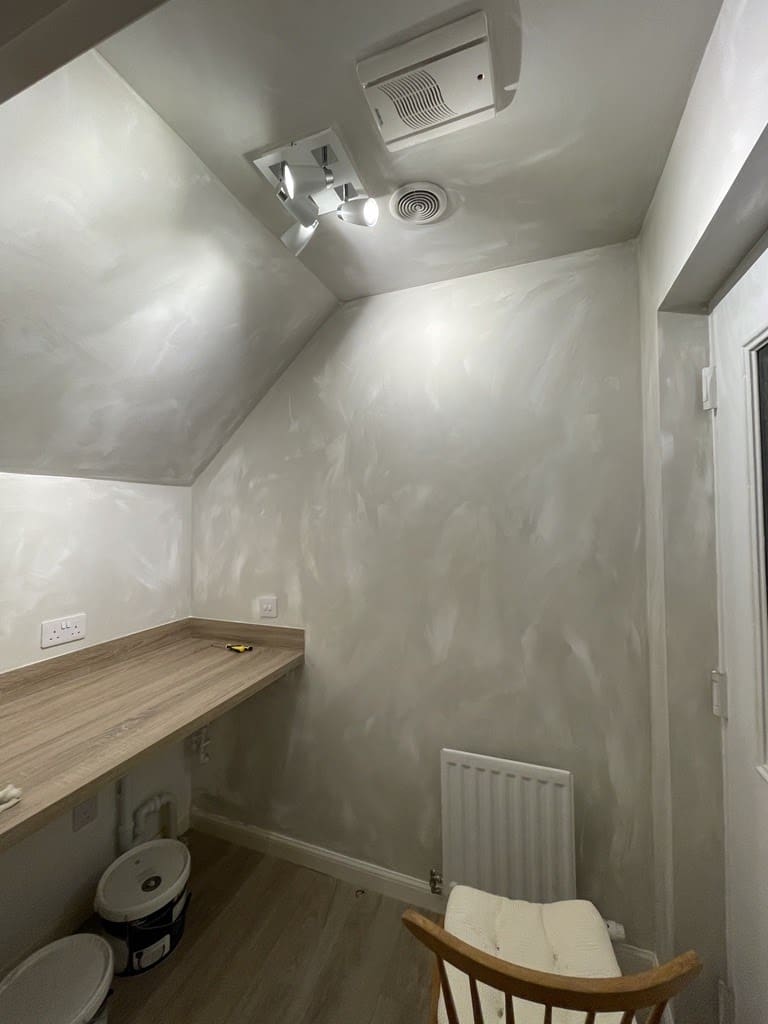 First coat of limewash paint applied to utility room